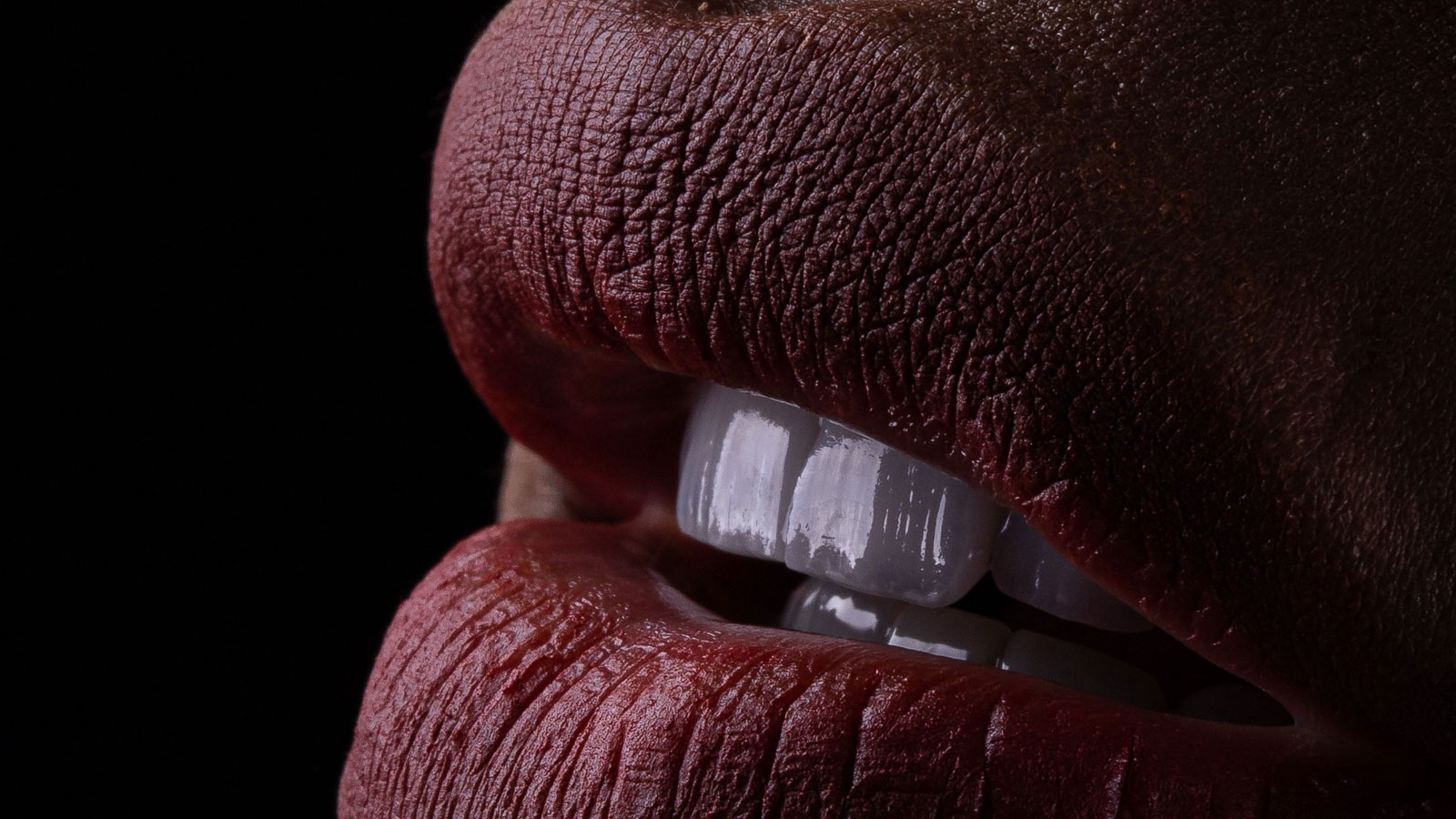 lipstick on thick lips close up with teeth showing